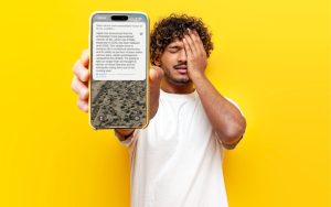 man holding phone with announcement